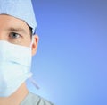 Mature male surgeon over a blue background Royalty Free Stock Photo