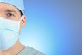 Mature male surgeon over a blue background Royalty Free Stock Photo
