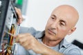 mature man assembling desktop computer Royalty Free Stock Photo