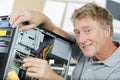 Mature man assembling laptop computer Royalty Free Stock Photo