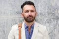 Mature man with beard standing against wall Royalty Free Stock Photo