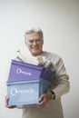 Mature Man Carrying Recycling Bin Royalty Free Stock Photo