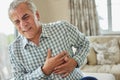 Mature Man Clutching Chest And Suffering Heart Attack At Home Royalty Free Stock Photo