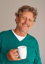 Mature man, coffee and portrait in studio with smile, confidence and excited for beverage by background. Person, senior Royalty Free Stock Photo