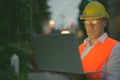 Mature man construction worker at the construction site in the city at night Royalty Free Stock Photo