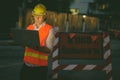 Mature man construction worker at the construction site in the city at night Royalty Free Stock Photo