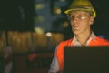 Mature man construction worker at the construction site in the city at night Royalty Free Stock Photo