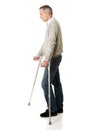 Mature man with crutches Royalty Free Stock Photo