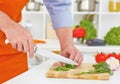 Mid section of mature man cutting vegetables in the kitchen. Royalty Free Stock Photo