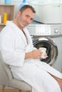 mature man doing morning laundry