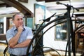 Mature man examines the exhibit in museum Royalty Free Stock Photo