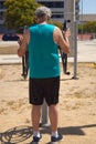 mature man doing sports on the street with sports machine Royalty Free Stock Photo