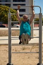 mature man training alone in the city with sports machines Royalty Free Stock Photo