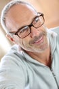 Mature man with eyeglasses relaxing at home Royalty Free Stock Photo