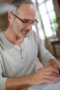 Mature man with eyeglasses using keyboard Royalty Free Stock Photo