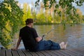 Mature man fishing from gangway Royalty Free Stock Photo