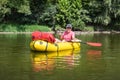 Mature man fishing from the packraft