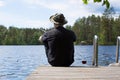 Mature man fishing from pier Royalty Free Stock Photo