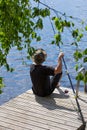 Mature man fishing from pier Royalty Free Stock Photo