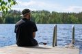 Mature man fishing from pier Royalty Free Stock Photo