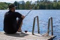 Mature man fishing from pier Royalty Free Stock Photo