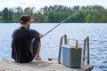 Mature man fishing from pier Royalty Free Stock Photo