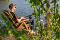 Mature man fishing from gangway Royalty Free Stock Photo