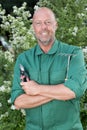 Mature man gardening outdoors Royalty Free Stock Photo