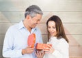 Mature man giving surprise gift to woman Royalty Free Stock Photo