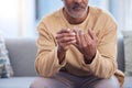 Mature man, hands or touching wedding ring on sofa in house, home or marriage counseling in divorce, break up or loss Royalty Free Stock Photo