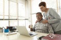 Mature man and his wife look at laptop Royalty Free Stock Photo