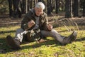 Mature man holding at the hands fresh mushrooms and enjoying Royalty Free Stock Photo