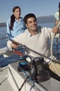 Mature Man Holding The Steering Of A Sailboat Royalty Free Stock Photo