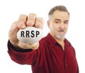 Mature man holds a white nest egg with RRSP on it Royalty Free Stock Photo