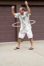 Mature man with hula hoop! Royalty Free Stock Photo