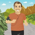 Mature man jogging in mountains with smartphone armband listening to music playlist on mobile phone app Royalty Free Stock Photo