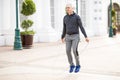 Mature man jumping a rope and exercising outdoors Royalty Free Stock Photo