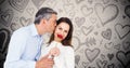 Mature man kissing while giving a red rose to woman Royalty Free Stock Photo