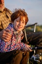 Mature man and little boy together at the pond. Little boy with fishing rod Royalty Free Stock Photo