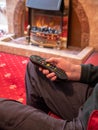 Elderly man living alone, with tv remote control in hand Royalty Free Stock Photo