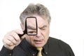 Mature Man with Magnifying Glass Royalty Free Stock Photo