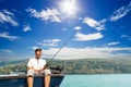 Mature man on a motor boat. Fishing Royalty Free Stock Photo