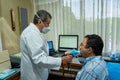 Mature man performing pulmonary function test and spirometry