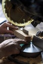 Mature man preparing lumber befor cut it with sliding compound miter saw outdoors. Home carpentry workshop Royalty Free Stock Photo