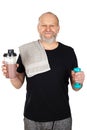 Mature man with protein shake and dumbbell Royalty Free Stock Photo