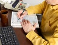 Mature Man putting information in tax tables