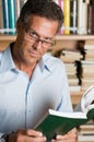 Mature man reading book Royalty Free Stock Photo