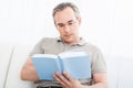 Mature man reading a book Royalty Free Stock Photo