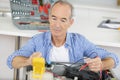 mature man repairing machine Royalty Free Stock Photo