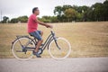 Mature man riding bicycle in countryside Royalty Free Stock Photo